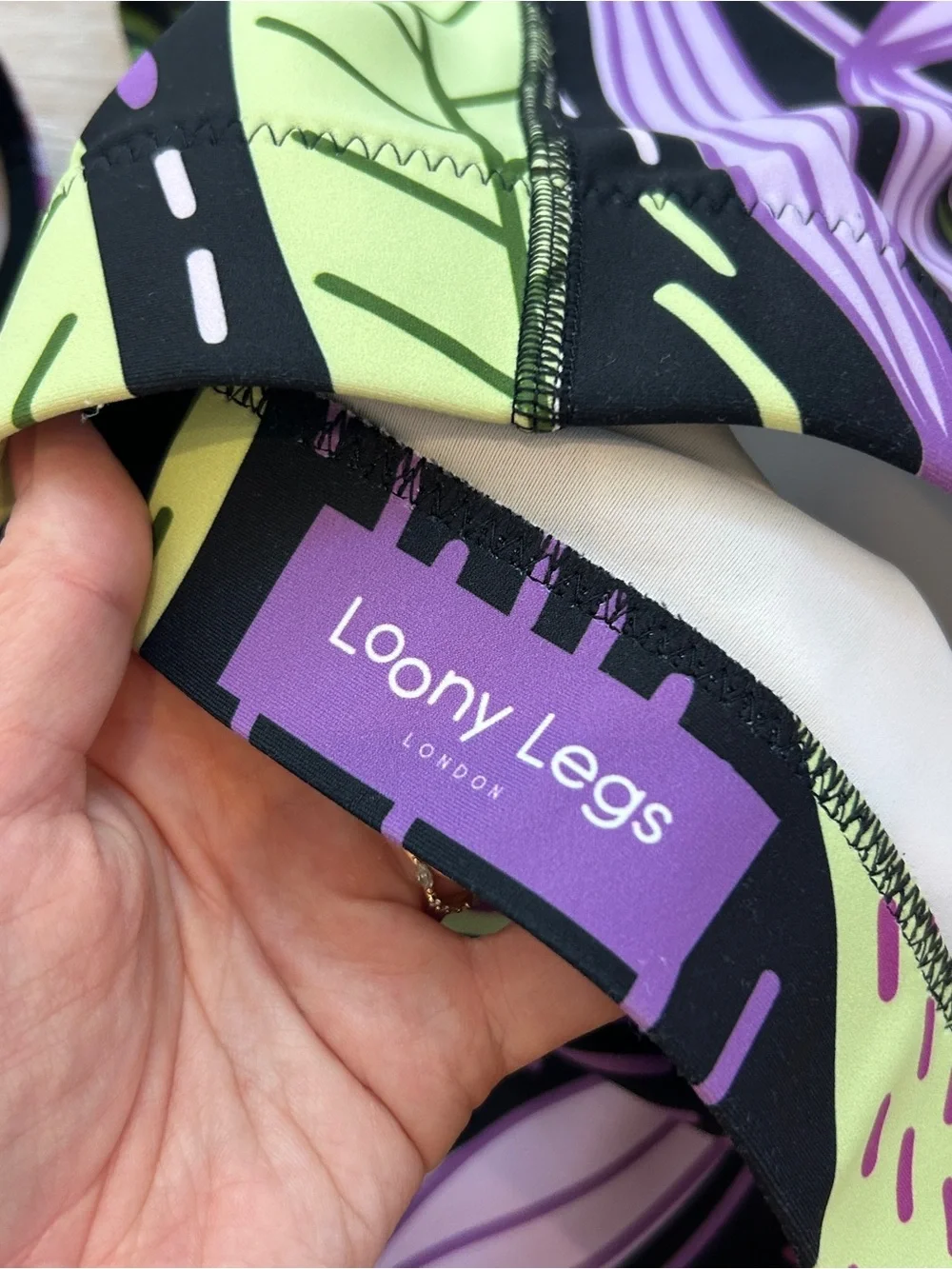 Loony Legs sports bra with purple/green leaf design size XL